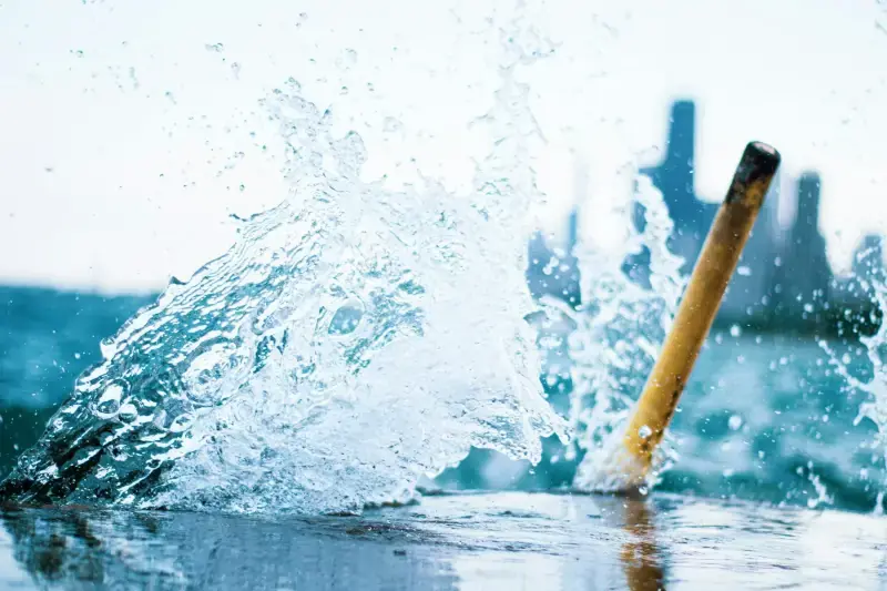 Water bursting out around a broken pipe